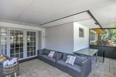 a living room with a couch and a table at MiaBella of Hollywood home in Hollywood