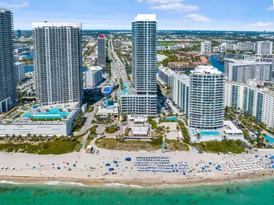 an aerial view of a beach at a resort at Gorgeous Views Await in Your Beachfront Condo in Hollywood
