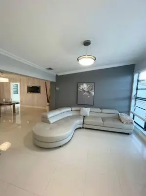 a large living room with a couch in the middle at Modern Miami Oversized 3 Bedroom in Central Location in Miami