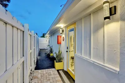 a hallway of a house with a yellow door at Laguna @ Casa Del Sol in Fort Lauderdale