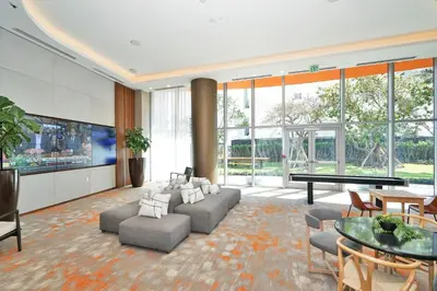 a living room with a couch and a table at Oceanfront Condo Direct Ocean & Beach Club Access in Hollywood
