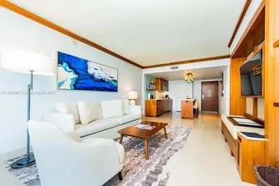 a living room with a white couch and a table at Ocean View Luxury Carillon Condo at Beach Access C616 in Miami Beach