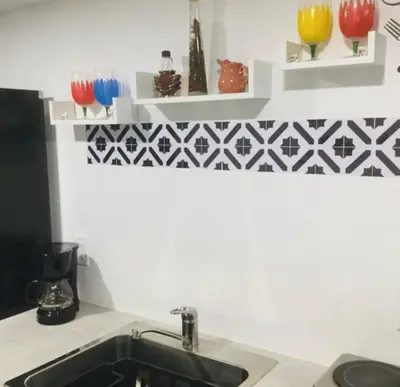 a kitchen counter with a sink and some shelves at NEW PRIVATE STUDIO MAGIC CITY OF MIAMI, GATED PARKING in Miami