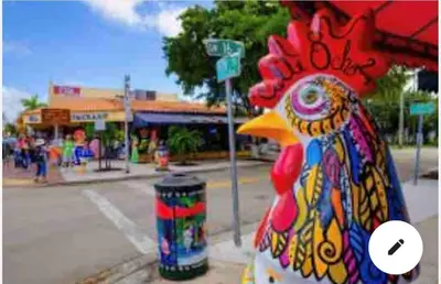 a chicken statue sitting on the side of a street at NEW PRIVATE STUDIO MAGIC CITY OF MIAMI, GATED PARKING in Miami