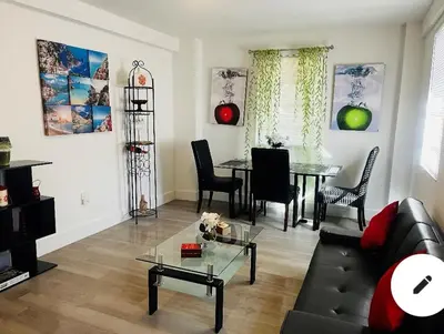 a living room with a couch and a table at Home Sweet Home in Miami