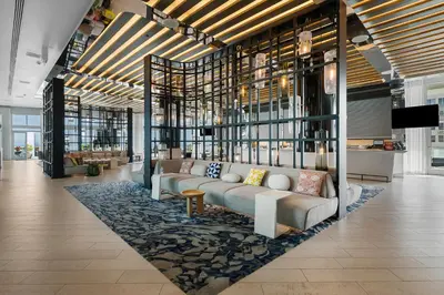 a lobby with a couch on a rug at Resort-Style Residence Beachfront Condo Oasis in Fort Lauderdale