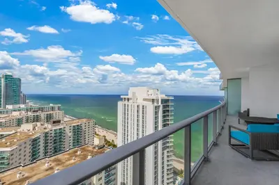 a balcony with a view of the ocean at Heaven Resort - 2BDR BEACH HOME WITH OCEAN VIEW HOLLYWOOD! in Hollywood