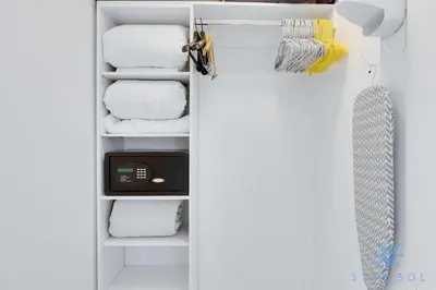 a closet with white towels on a shelf at Infinite View - Balcony - Gym - Pool in Hallandale Beach