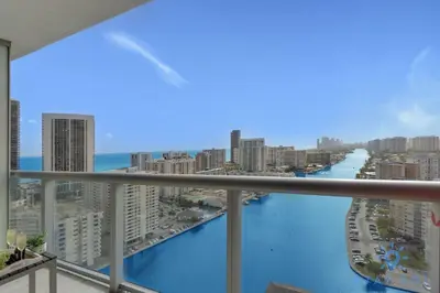a view of the ocean from the balcony of a building at Infinite View - Balcony - Gym - Pool in Hallandale Beach