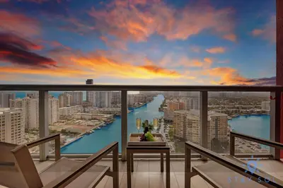 a view of a city from a balcony at Infinite View - Balcony - Gym - Pool in Hallandale Beach