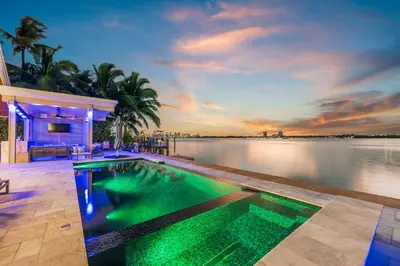 a swimming pool in the middle of a body of water at Best Sunset View on the Bay with Pool in Miami Beach