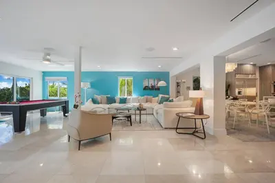 a living room with couches and a pool table at Best Bayfront View Heated Pool in Miami Beach