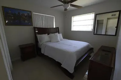 a bedroom with a bed and a ceiling fan at Airbnb rental in Miami