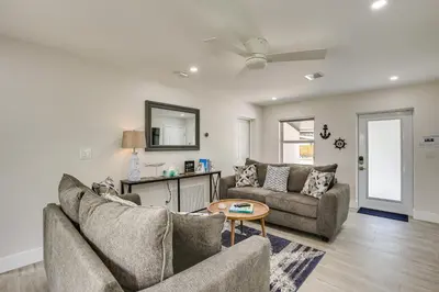a living room with two couches and a table at Fort Lauderdale Vacation Rental about 8 Mi to Beaches! in Fort Lauderdale