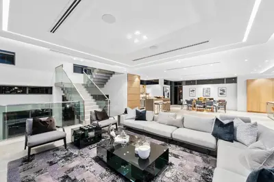 a living room with a couch and a table at Park Place Mansion in Fort Lauderdale