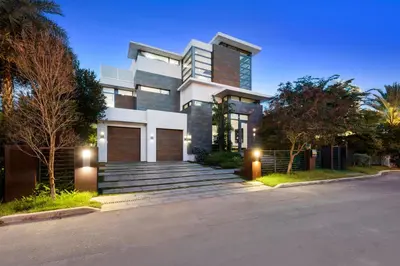 a house with a driveway in front of it at Park Place Mansion in Fort Lauderdale