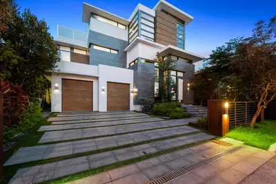 a modern house with a pathway in front of it at Park Place Mansion in Fort Lauderdale