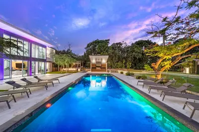 a swimming pool in the backyard of a house at Modani Estates in Miami