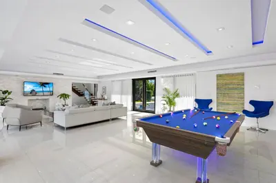 a living room with a pool table in it at Villa Paraiso in Hollywood