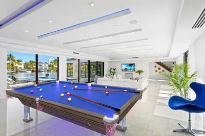 a pool table with balls on it in a living room at Villa Paraiso in Hollywood