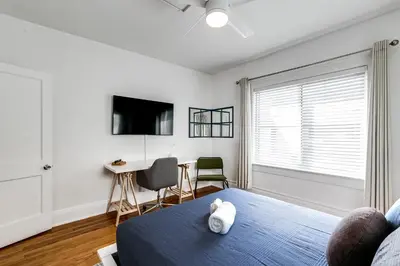 a bedroom with a bed and a table and chairs at Comfy Little Havana Apt - Centrally located Hv2 in Miami