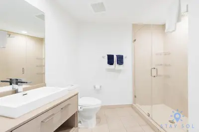 a bathroom with a sink and a toilet and a shower at Rooftop Oceanview Balcony Beachfront Resort in Hollywood