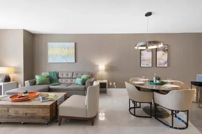 a living room with a couch and a table at Rooftop Oceanview Balcony Beachfront Resort in Hollywood