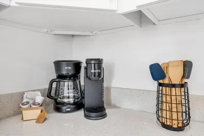 a coffeemaker and a coffee maker on a kitchen counter at Urban Seaside in Dania Beach