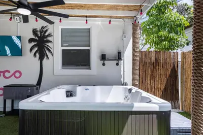 a large bath tub in a yard with a window at Coco Loco - Little Havana in Miami