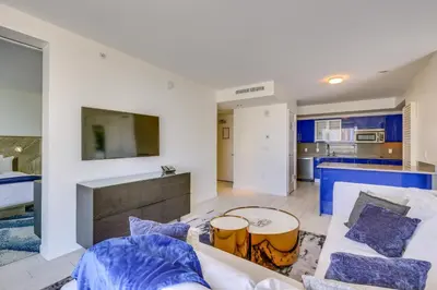 a living room with a couch and a table at Fort Lauderdale Condo with Veranda and Ocean View! in Fort Lauderdale