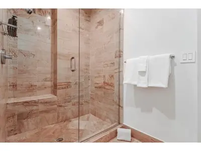 a shower with a glass door in a bathroom at 2-Story 3BD Brickell Penthouse Free Parking Heated Pool in Miami