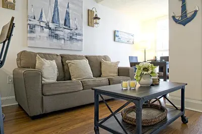 a living room with a couch and a coffee table at 1bed 1bath Steps To Marina & Cocowalk In Grove in Miami