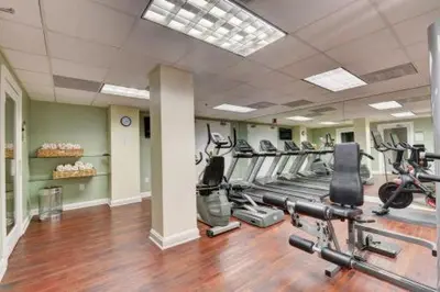 a gym with a bunch of exercise bikes in it at 1bed 1bath Steps To Marina & Cocowalk In Grove in Miami
