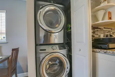 two washer and dryer in a small kitchen at Private Pool and Patio Fort Lauderdale Home! in Fort Lauderdale