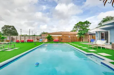 a swimming pool in the yard of a house at Private Pool and Patio Fort Lauderdale Home! in Fort Lauderdale