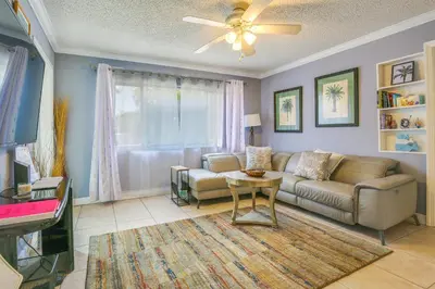 a living room with a couch and a table at Private Pool and Patio Fort Lauderdale Home! in Fort Lauderdale