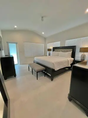a bedroom with a bed and a tv in it at Villa Gia Large Home Near Brickell Miami Beach in Miami