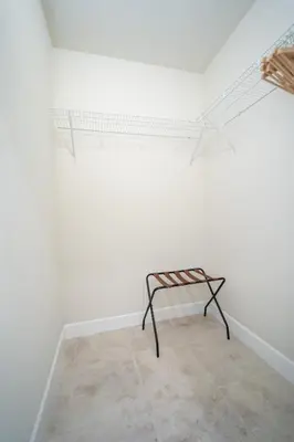a bench in a room with a white wall at Miami Luxury 5BD Home! Next to Wynwood & Design district in Miami