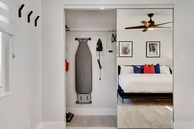 a bedroom with a bed and a dresser and a fan at Oceana @ Casa Del Sol in Fort Lauderdale