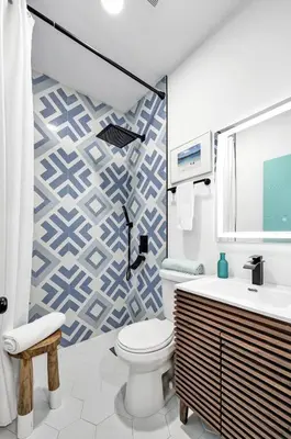 a bathroom with a toilet and a sink at SOBE Monarch 1 - 2 BEDROOM 2 BATHROOM - MODERN APTS -WALK TO OCEAN DRIVE -2 INDEPENDENT 1 BEDROOM 1 BATHROOM APTS in Miami Beach