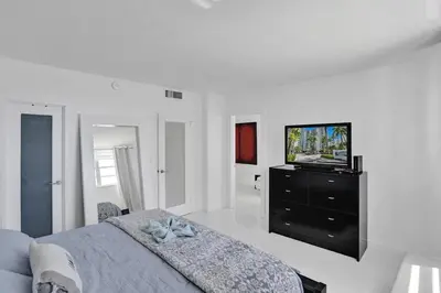 a bedroom with a bed and a television on a dresser at Beautiful 1 1 Beach View 14 Floor in Hollywood