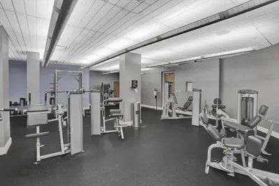 a gym with several treadmills and machines at Beautiful 1 1 Beach View 14 Floor in Hollywood