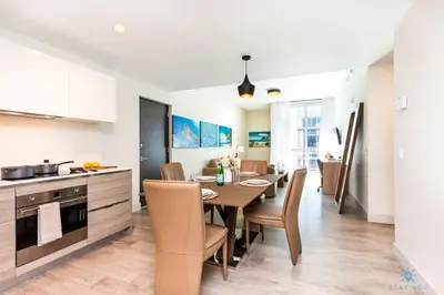 a kitchen and dining room with a table and chairs at Cozy Apartment - Hollywood Beach - Amazing Pool in Hollywood