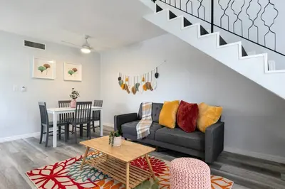a living room with a couch and a table at Loft style 1b Apt , Fast Wi-Fi Virg14 in Miami