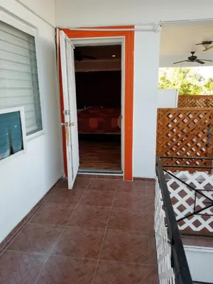 a porch with a door open to a bedroom at Royal Budget Inn in Miami
