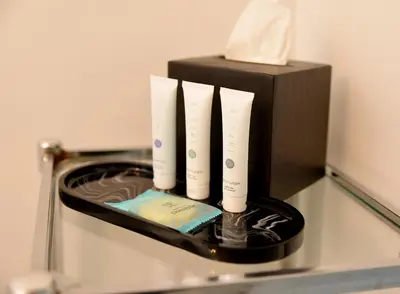 a group of four white candles in a microwave at Relaxing Condo Hotel In The Grove, Free Parking in Miami