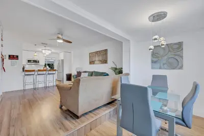 a living room with a couch and a table at Tranquil Pool Home in Hollywood Close to Beach Airport in Hollywood