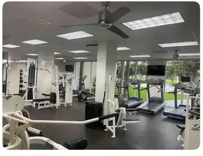 a gym with treadmills and elliptical machines at SPECIAL Beautiful Modern Beach Condo in Miami Beach
