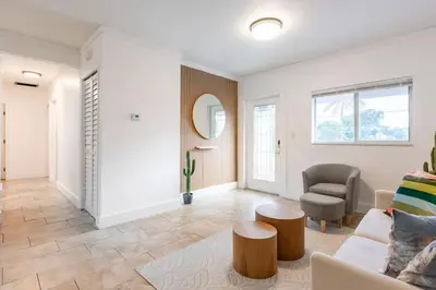a living room with a couch and a chair at Cozy Miami Home Pet-friendly & with Free Parking in Miami