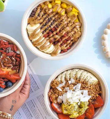 a table with three bowls of different types of food at LUXURY APARTMENT - Direct Bay in South Beach in Miami Beach